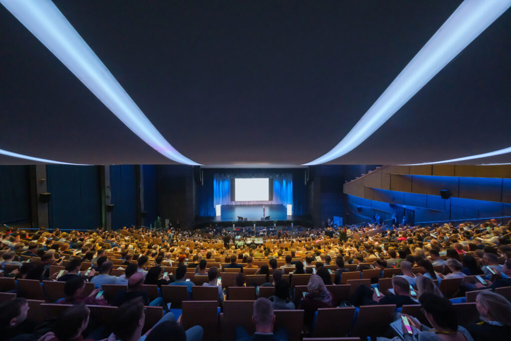 Svetlogorsk, Russia - October 11, 2019: Business conference attendees sit and listen to lecturer at hall, top rear view